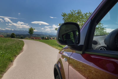 Reflection of road on side-view mirror