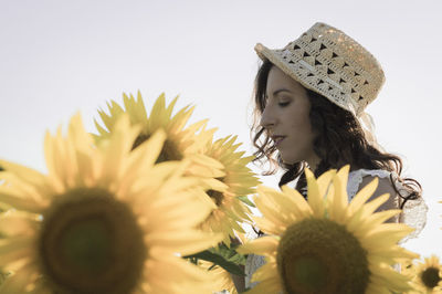 Close-up of young woman with flowers