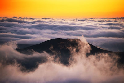 Scenic view of mountains against sky during sunset