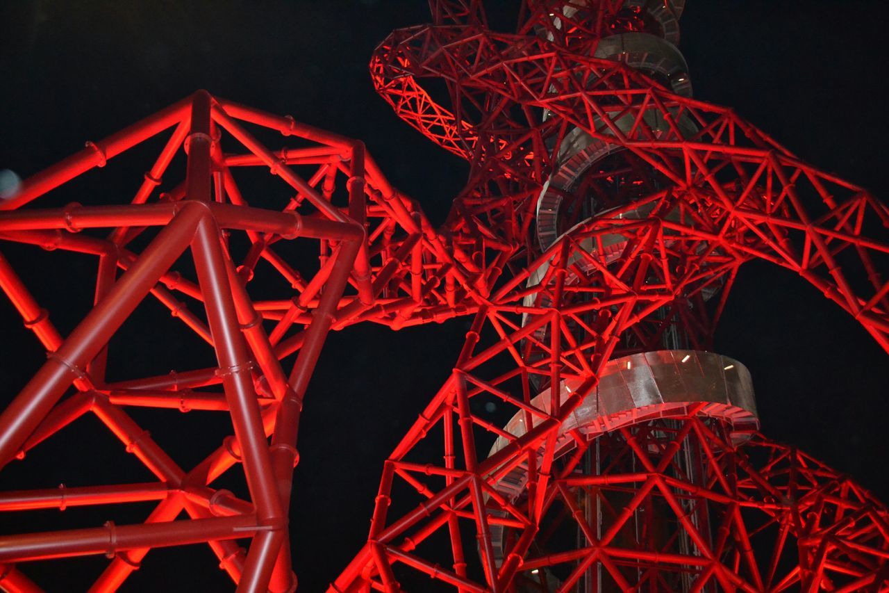 red, night, illuminated, low angle view, metal, arts culture and entertainment, built structure, clear sky, metallic, no people, tradition, sky, dark, outdoors, architecture, copy space, cultures, lighting equipment, light - natural phenomenon, famous place