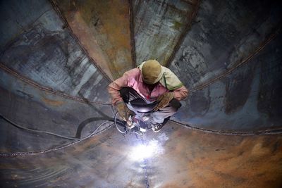 High angle view of man working in tunnel