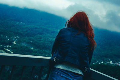 Rear view of woman looking at mountain