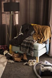 Clothes on sofa at home