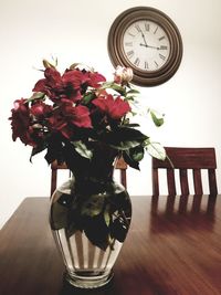 Close-up of rose flower vase on table