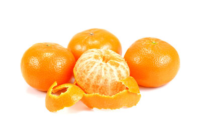 Close-up of oranges against white background