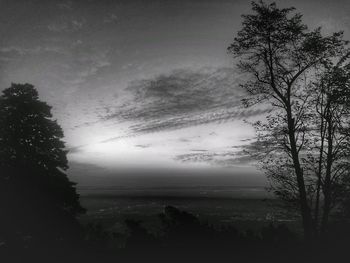 Scenic view of silhouette trees against sky