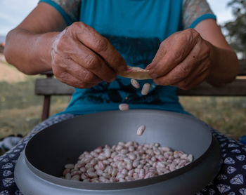 Close-up of man preparing food