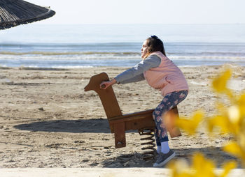 Rear view of man on beach