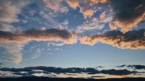 Low angle view of clouds in sky during sunset