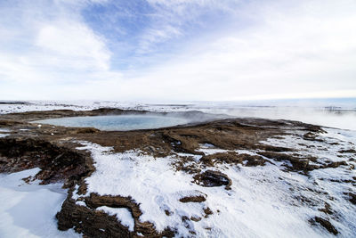 Scenic view of sea against sky during winter