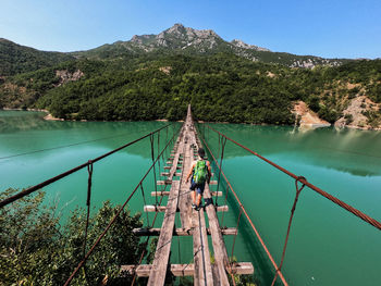 Low angle view of footbridge against sky