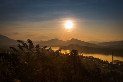 Scenic view of silhouette mountains against sky during sunset