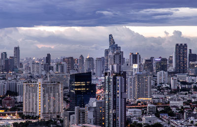 High angle view of modern buildings in city against sky