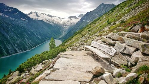 Scenic view of mountains against cloudy sky