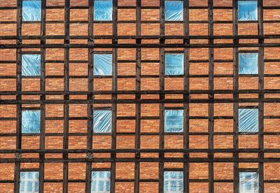 Prussian wall texture. wooden beams and bricks with windows in foil