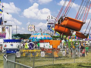 Amusement park against cloudy sky