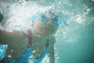 Woman swimming in sea