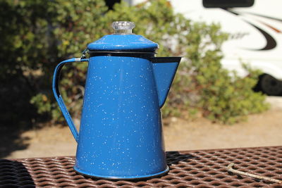 Close up of blue jug on table