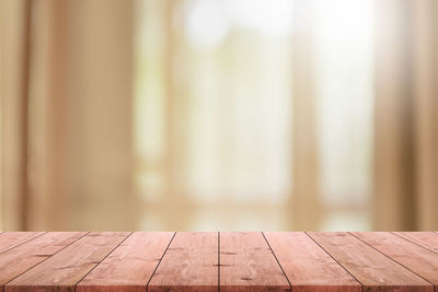 Close-up of wooden table at home