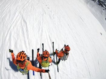 High angle view of people on snow covered mountain