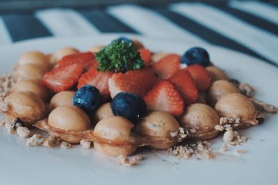 Close-up of fruits in plate on table