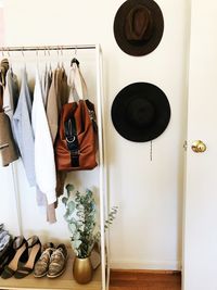 Garment rack in bedroom styled with accessories