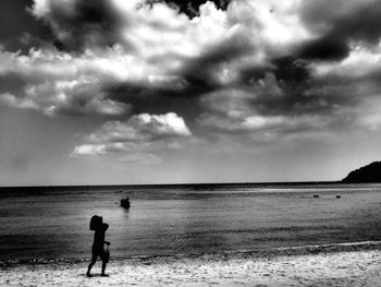 Scenic view of sea against cloudy sky