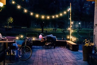 Man and woman on illuminated street at night