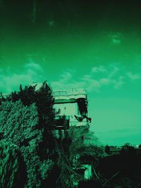 Low angle view of abandoned built structure against blue sky