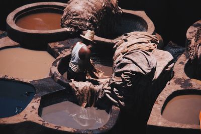 High angle view of men working on wood