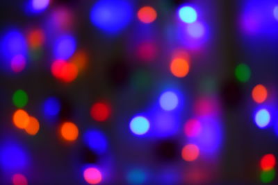 Defocused image of illuminated lights at night