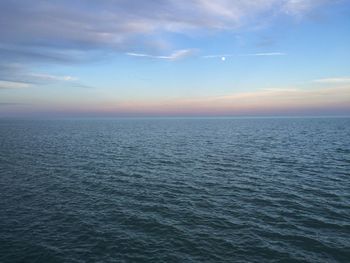 Scenic view of sea against sky at sunset