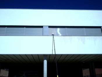 Low angle view of building against clear blue sky