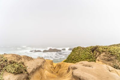 Scenic view of sea against clear sky