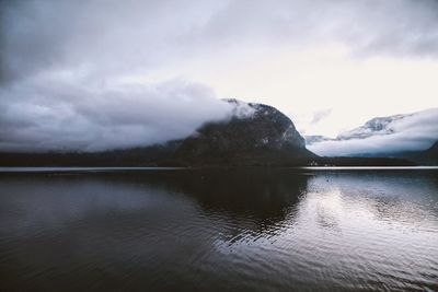 Scenic shot of calm lake against mountain range