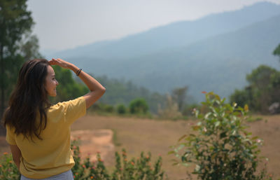 Back view point of young women looking at faraway , hope and dream concept