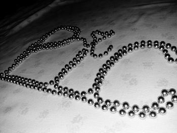 Close-up of necklace on table