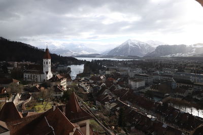 High angle view of townscape against cloudy sky