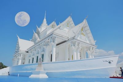 Low angle view of building against blue sky