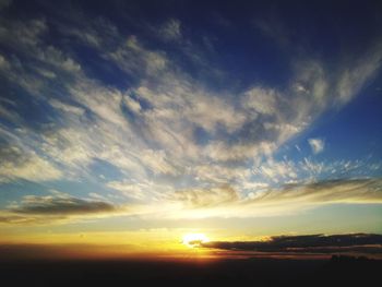 Low angle view of dramatic sky during sunset