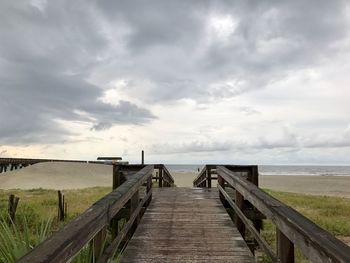 Pier over sea against sky