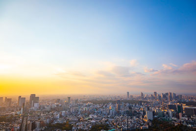 Cityscape against sky during sunset