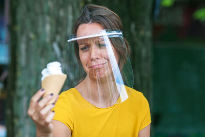 Sad woman holding ice cream