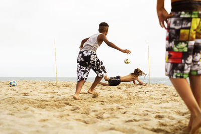 Boys playing at beach