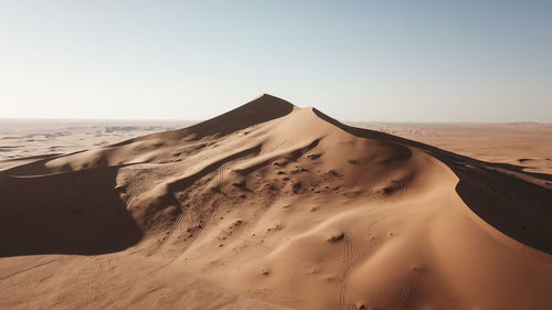 Scenic view of desert against clear sky