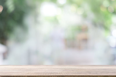 Close-up of wooden railing on table