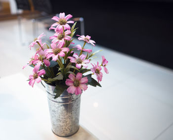 Close-up of flower vase on table