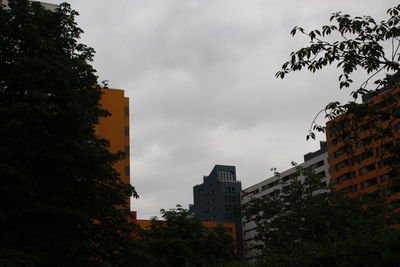 Low angle view of building against cloudy sky