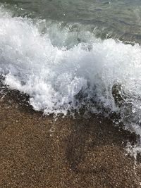 High angle view of waves on shore