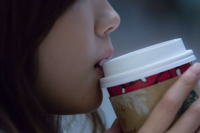 Close-up of young woman eating